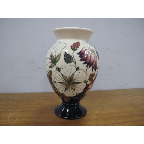 A Moorcroft Pottery Vase, painted in the 'Bramble Revisited'...