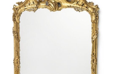 A North German Rococo mirror, the carved giltwood frame, adorned with openwork...