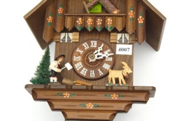 A PAINTED AND CARVED WOODEN COOKOO CLOCK. PROBABLY GERMAN, WITH CLOCK WORK ACTIVATED FIGURES INCLUDING A CHIMNEY SWEEP - MECHANISM N...