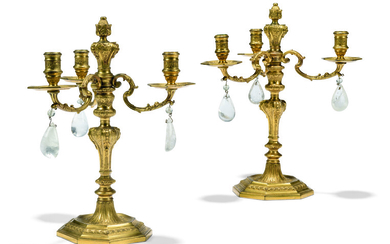 A PAIR OF FRENCH ORMOLU AND ROCK-CRYSTAL THREE-LIGHT CANDELABRA