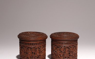 A PAIR OF INDIAN SANDALWOOD CYLINDRICAL BOXES AND COVERS