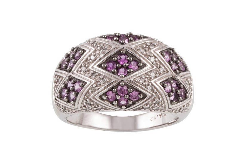 A PINK SAPPHIRE AND DIAMOND DRESS RING, pavé set in white go...