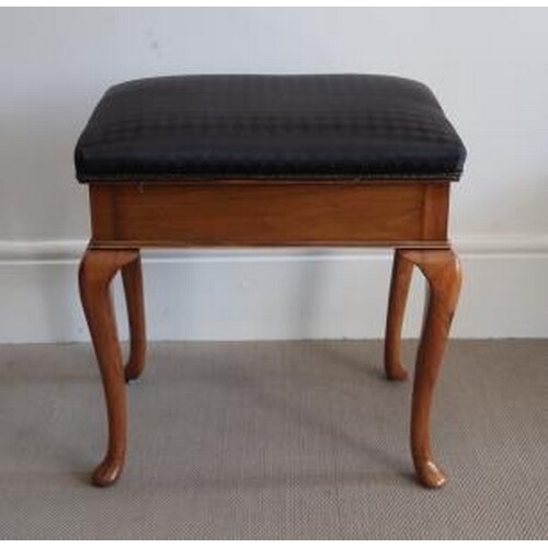 A Queen Anne style piano stool raised on cabriole supports, ...