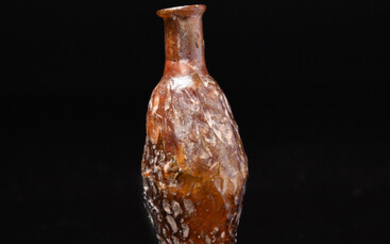 A Roman amber glass date flask