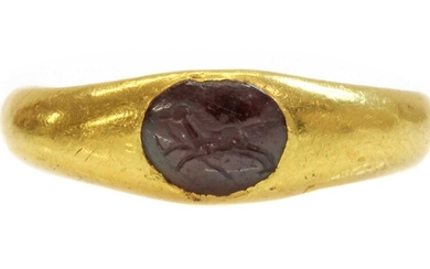 A Roman high carat gold garnet intaglio ring