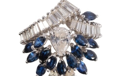 A SAPPHIRE AND DIAMOND CLUSTER RING the central pear-cut dia...