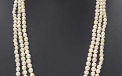 A TRIPLE STRAND OF NATURAL PEARL GRADUATING FROM 2.8MM TO 6.9MM, TO A 9CT GOLD ENGRAVED CLASP, LENGTH 38CMS