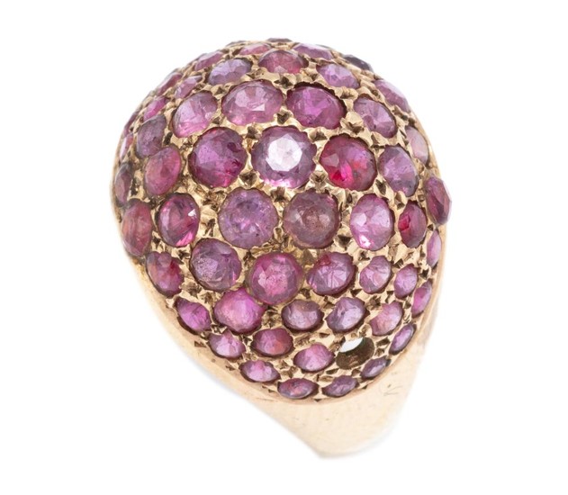 A VINTAGE 18CT GOLD RUBY RING; dome top set with round cut rubies (1 missing), size P 1/2, wt. 5.56g.
