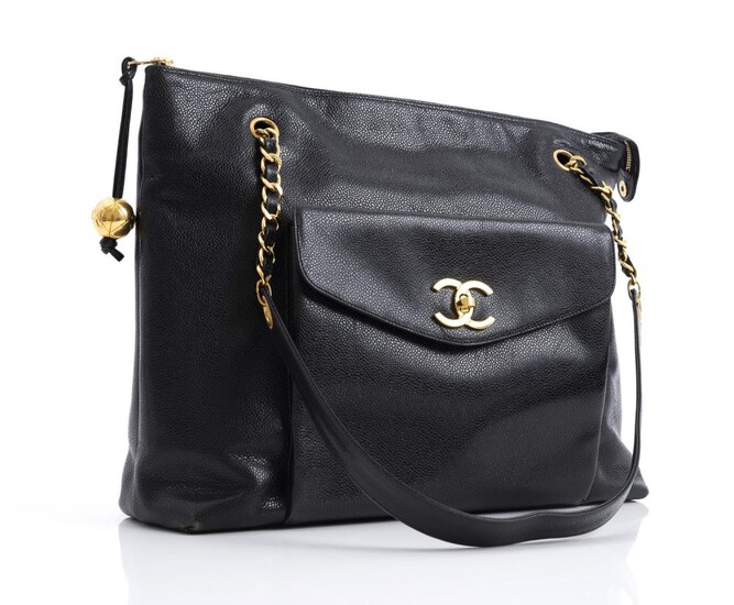 A VINTAGE TOTE BAG BY CHANEL-Styled in black Caviar leather with gold metal hardware, 30 x 36 x 11cm.
