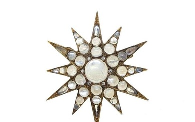 A Victorian moonstone star brooch, twelve pointed star with a central round cabochon moonstone