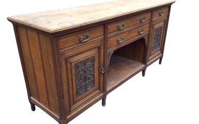 A Victorian oak sideboard, the moulded rectangular top above two...