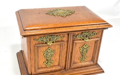 A Victorian oak stationery box with applied brass plaques,...