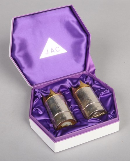 A boxed pair of limited edition silver and silver gilt peppe...