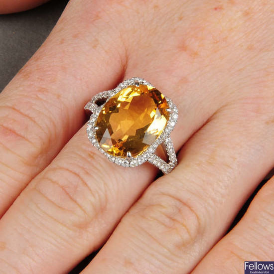A citrine and diamond dress ring.