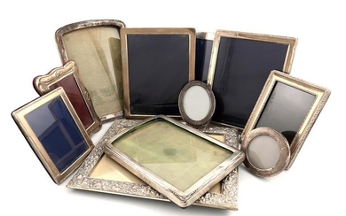 A collection of silver photograph frames, various dates...