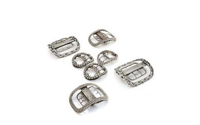 A collection of silver shoe buckles