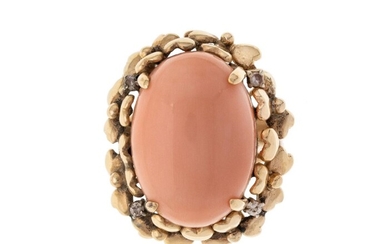 A coral and diamond ring, centring on an oval coral corallium rubrum, cabochon framed by shamrock motif accented with single-cut diamond points, c.1960, ring size M 1/2