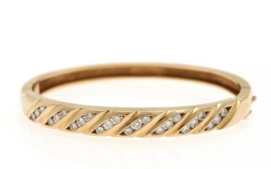 A diamond bangle set with numerous brilliant-cut diamonds, mounted in 14k gold. 5×5.8 cm.