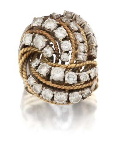 A diamond cluster ring, of knotted wirework design, the knot set with rows of graduated brilliant-cut diamonds, stamped 750, ring size approx. M