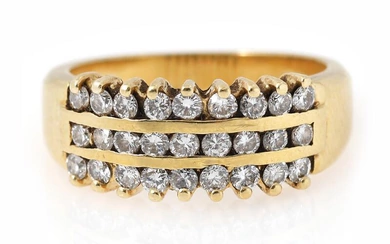 A diamond ring set with numerous brilliant-cut diamonds in three rows weighing...