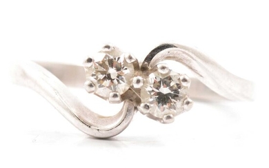 A diamond two stone crossover ring.