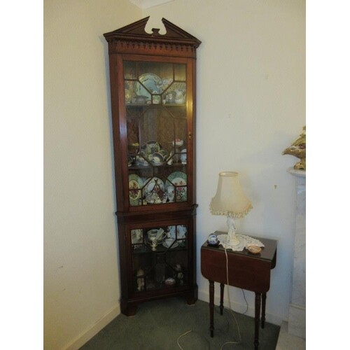 A fine antique inlaid mahogany corner cabinet having swan pe...
