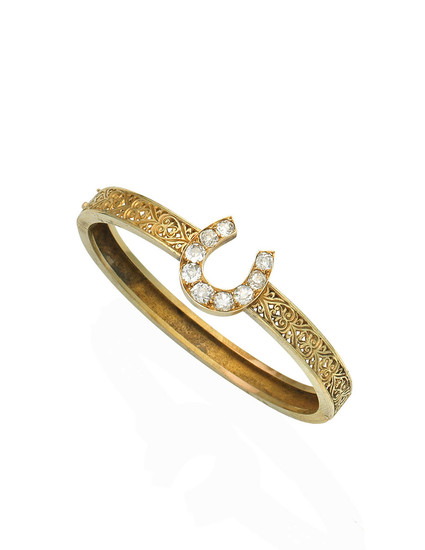 A gold and diamond bangle