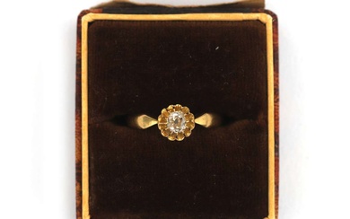 A gold diamond solitaire ring with an old mine cut diamond, ca. 1900