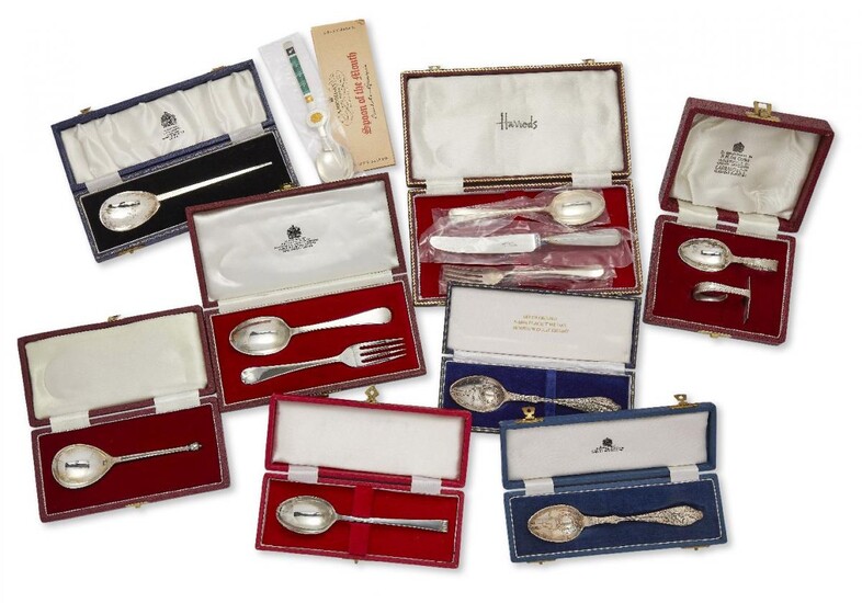 A group of cased silver christening sets of flatware including: an Asprey & Co. silver fork and spoon set, London, c.1972; a hammered silver spoon by Mappin & Webb; two decorative 'birth year' silver spoons; a silver knife, fork and spoon set...