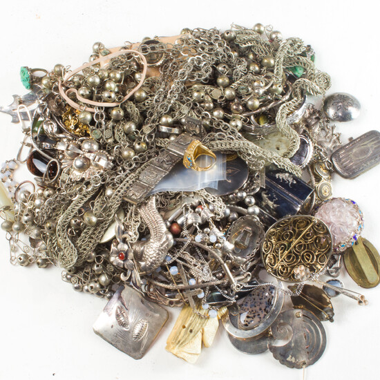 A group of silver and metal jewelry