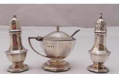 A hallmarked silver three piece condiment set, approx total ...