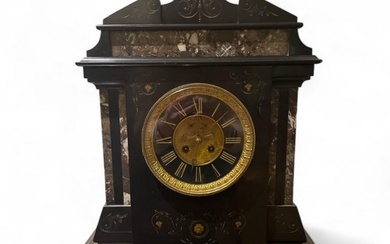 A large and impressive Victorian black marble mantel clock with...