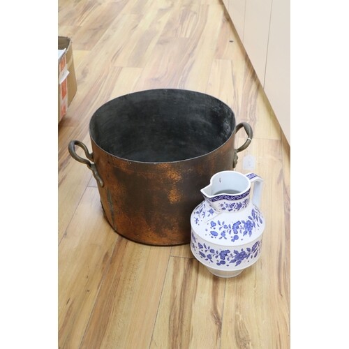 A large copper two handled preserve pot and a large modern b...