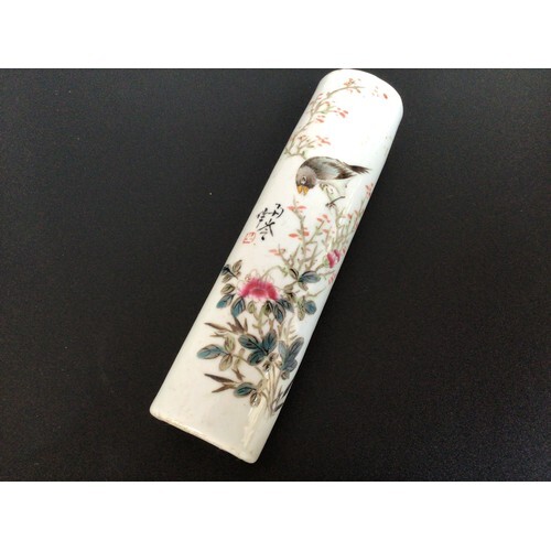A late 19th/early 20th century porcelain scroll/paperweight,...