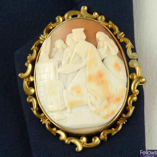 A late Victorian gold mounted shell cameo brooch, carved to depict a Queen, possibly giving offerings of devotion.
