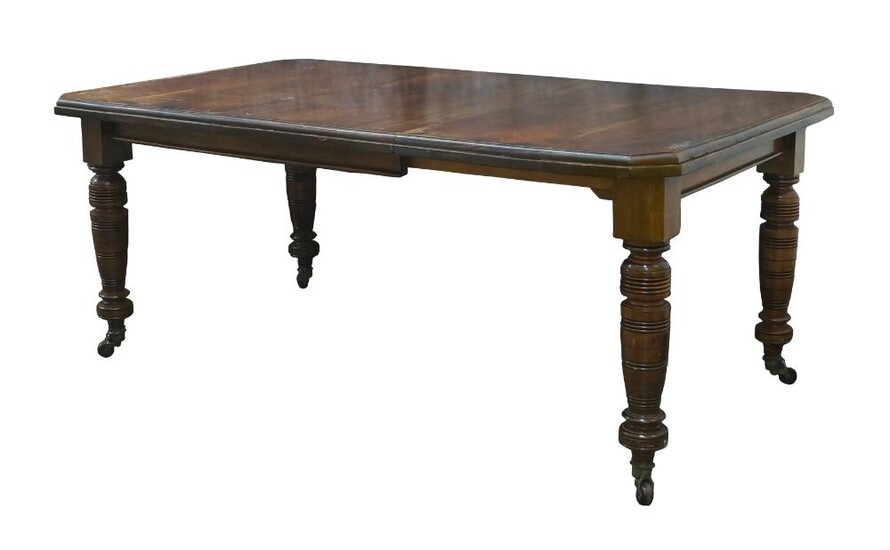A late Victorian mahogany wind out dining table, with one extra leaf, raised on turned legs and castors, 71cm high, 175cm wide, 103cm deep Provenance: Property of Future PLC, removed from the offices of Country Life magazine.