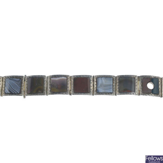 A late Victorian silver banded agate, jasper, bloodstone and carnelian bracelet, designed to depict a belt, by George Unite.