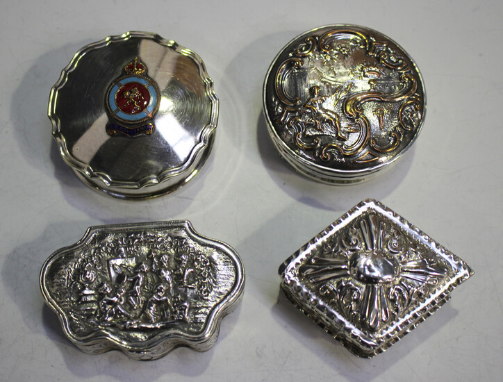 A late Victorian silver lozenge shaped box with hinged lid, decorated in relief with scrolls within