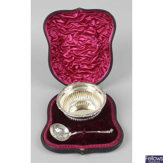 A late Victorian silver sugar bowl and sifter spoon, in fitted case.