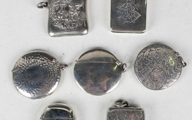A late Victorian silver vesta case, the front embossed with two maidens and a musician in a garden