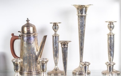 A lot of eight sterling weighted vases or candlesticks