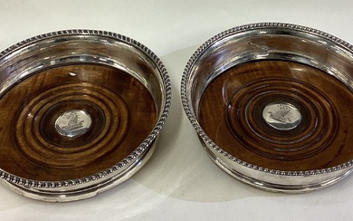 A matched pair of George III silver coasters.