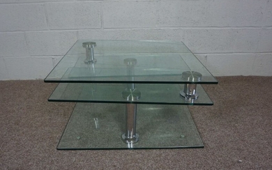 A modern glass foldout coffee table, with square top, 42cm high, 79cm wide