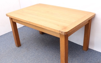 A modern light-oak kitchen dining table - the cleated, recta...