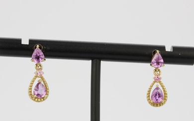 A pair of 10ct yellow gold drop earrings set with pear cut pink sapphires, L. 1.5cm.