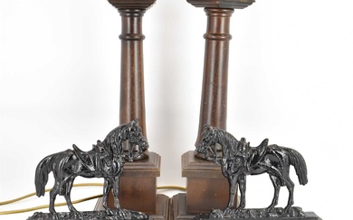 A pair of 19th century cast iron horse doorstops, later...
