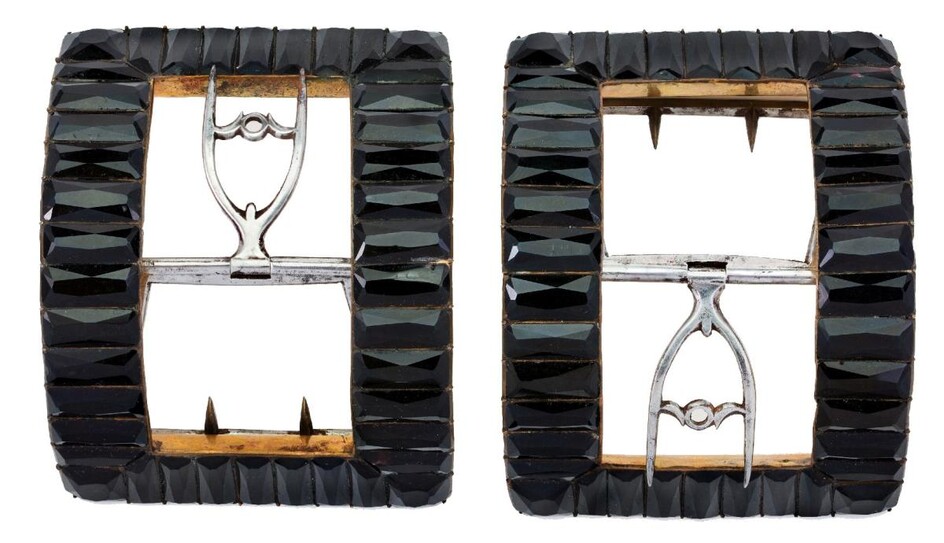 A pair of Georgian faceted black glass shoe buckles, each gilt-metal buckle set with rectangular facetted 'French jet' (glass) to steel fittings, c.1790 (2)