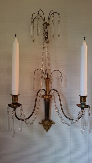 NOT SOLD. A pair of Louis XVI style bronze and crystal bracket lamps. C. 1900....