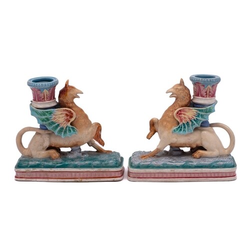 A pair of Royal Worcester majolica Griffin candlesticks: eac...