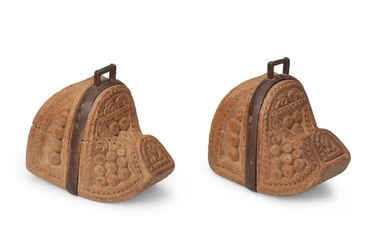 A pair of South American carved wood stirrups